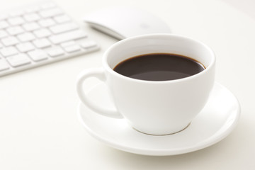 Coffee and computer on office desk