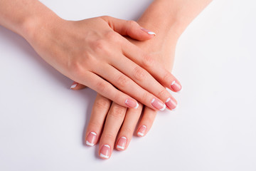 Woman's manicure on a white background. - 99372116