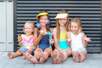 Portrait of happy children on nature in summer