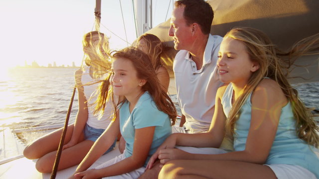 Smiling Caucasian Family Female Siblings Ocean Yacht Freedom Living Success