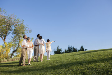Intimate family looking at view in a park