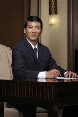 A businessman uses the hotel business center