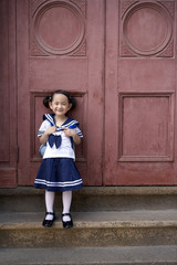 Fototapeta na wymiar A child in her school uniform