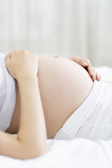 Obraz na płótnie Canvas Pregnant woman's belly
