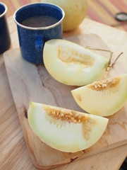 Fresh slice Cantaloupe melon pieces in wood plate