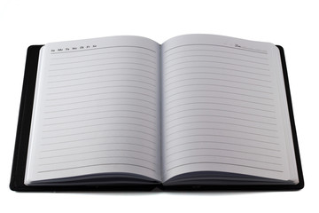 The black leather moleskin notebook on white