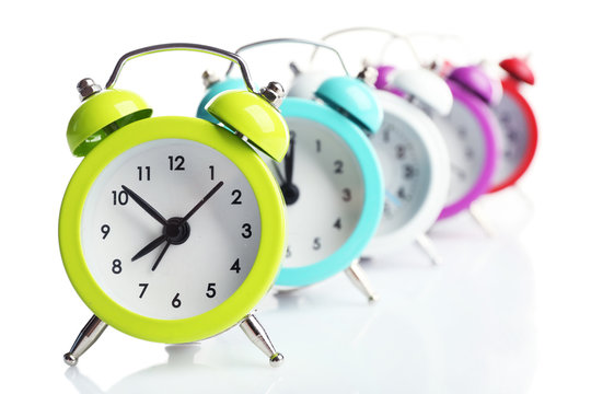 A group of alarm clocks, isolated on white