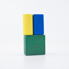 The wooden house. Children's toys - wooden cubes on a white background
