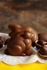 Easter chocolate bunny and eggs on wooden background