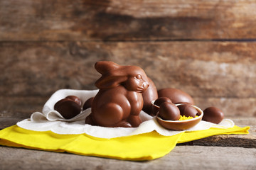 Easter chocolate bunny and eggs on wooden background