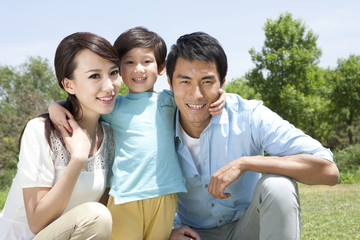 Happy Chinese family in a park