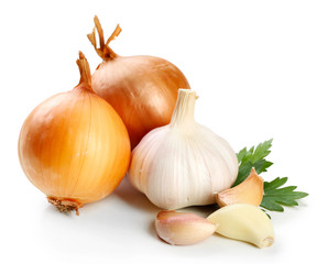 Garlic and onion with parsley leaves isolated on white