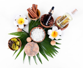 Beautiful spa setting on palm leaf, isolated on white