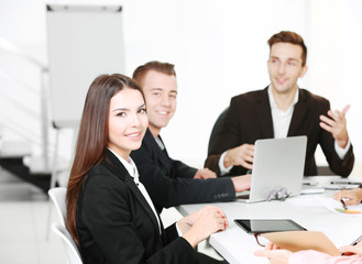 Photo of business woman in conference room at the meeting