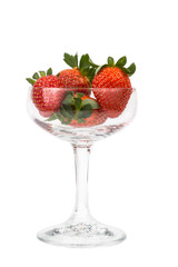 Juicy strawberries in a transparent cocktail glass with white background