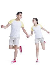 Fototapeta premium Happy young couple holding hands
