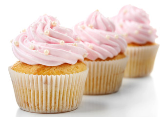 Pink cupcakes isolated on white