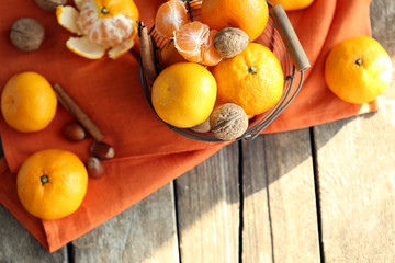 Tangerines on old wooden table, close up