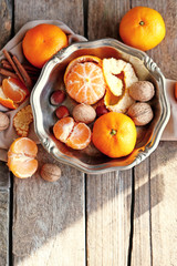 Tangerines on old wooden table, close up