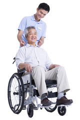 Fototapeta na wymiar Male nursing worker helping senior man doing massage on the back