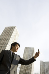 Businessman looking at cell phone