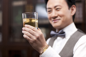 Businessman appreciating fine wine