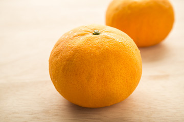 fresh oranges on wooden background