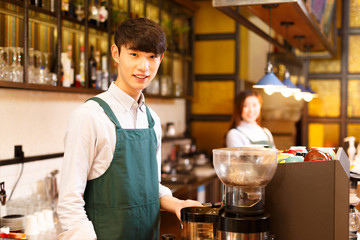 portrait waitress and waiter in cafe