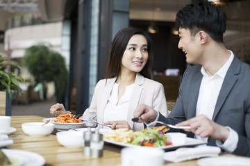 Young couple dining in restaurant