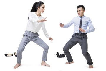 Businessman and businesswoman fighting