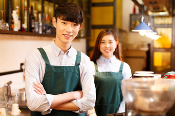 portrait waitress and waiter in cafe