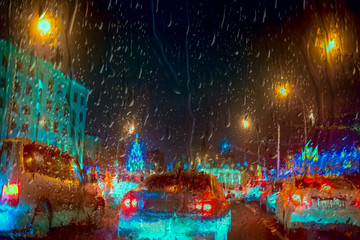 Inside the car - night rain and town lights