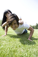 Young couple having fun in park