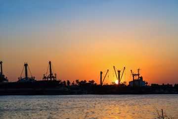 Fototapeta na wymiar Sunset at river port