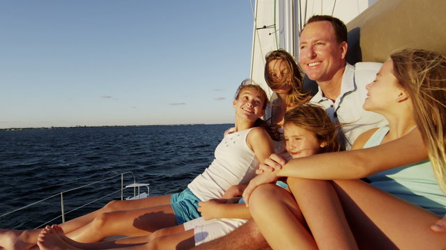 Smiling Caucasian Family Female Siblings Ocean Yacht Freedom Living Investment