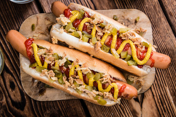 Hot Dog with onions, cucumbers and sauces