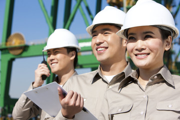 shipping industry workers looking in the distance