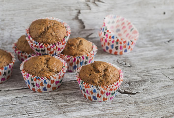 Oatmeal and banana vegan muffins on rustic light wooden board. Healthy food