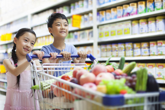 Children shopping in supermarket