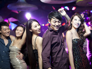 Fototapeta premium Stylish young people dancing in nightclub
