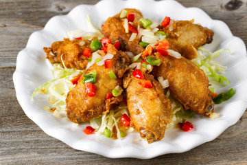 Chicken wings in white plate ready to eat