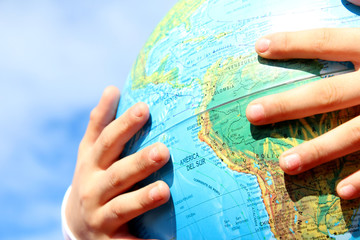 child holding earth in hands