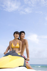 Obraz premium Young couple on a jet ski