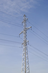  top part of tower of high voltage transmission lines and wires closeup