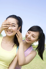 Portrait of two girlfriends at the park