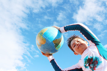 child holding earth in hands