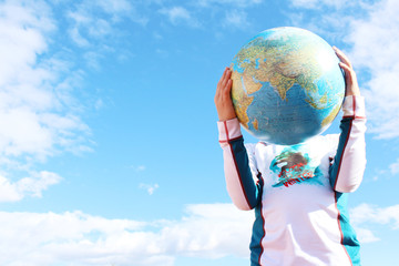 child holding earth in hands