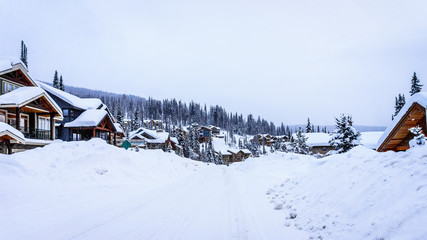 Snow covered roads, trees and houses in the Ski Resort village of Sun Peaks in the Shuswap Highlands in central British Columbia, Canada