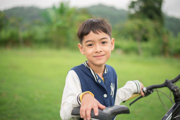 Fototapeta premium Little boy with a bike