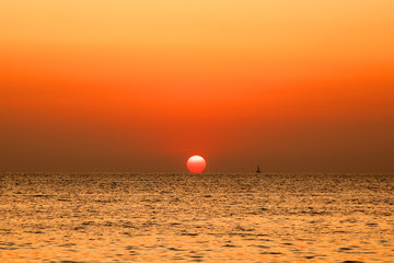 Mirage of astronomical objects, Omega Sunset, Expanse of the sea against the sunset sky, Beautiful seascape, Natural composition.